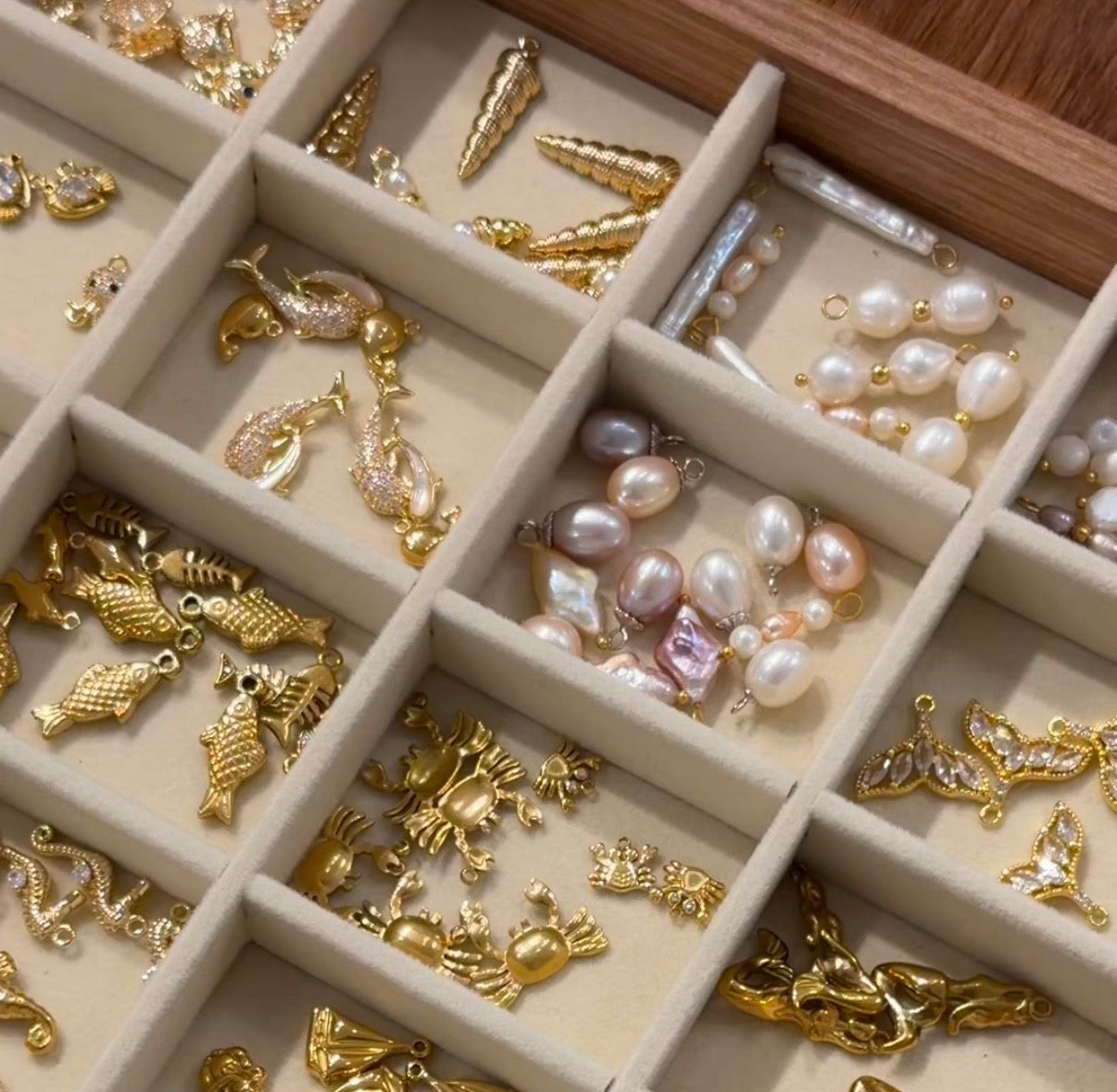 Jewelry box with gold and pearl charms