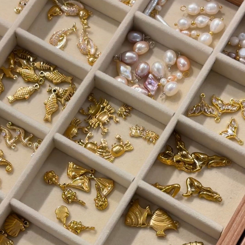 Jewelry box with gold and pearl charms